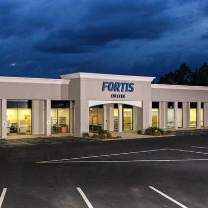 Fortis College building exterior at dusk